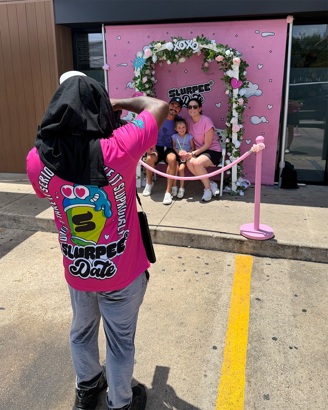 Photographer shooting a family at the Slurpee Date activation